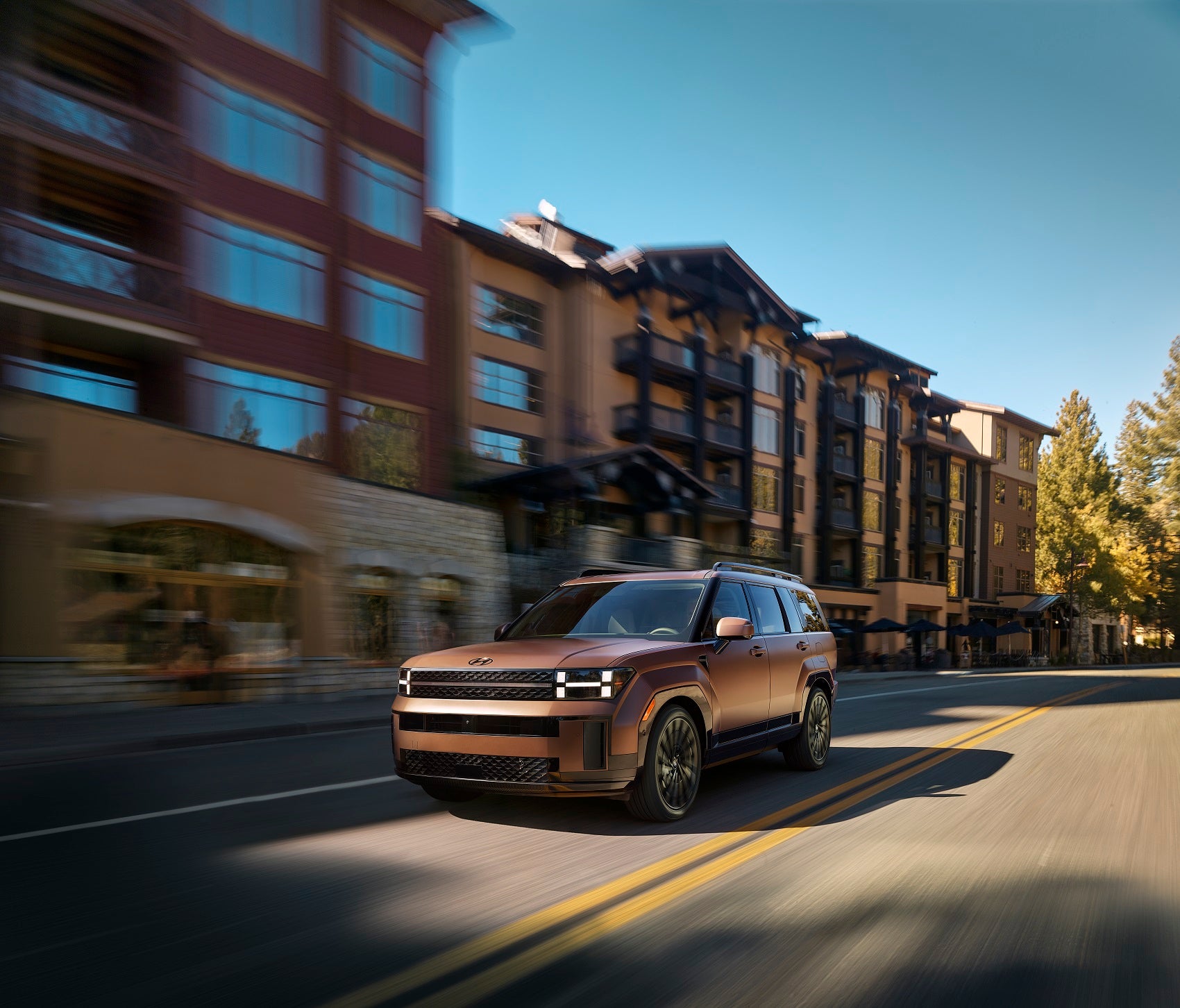 Hyundai Santa Fe driving through downtown street