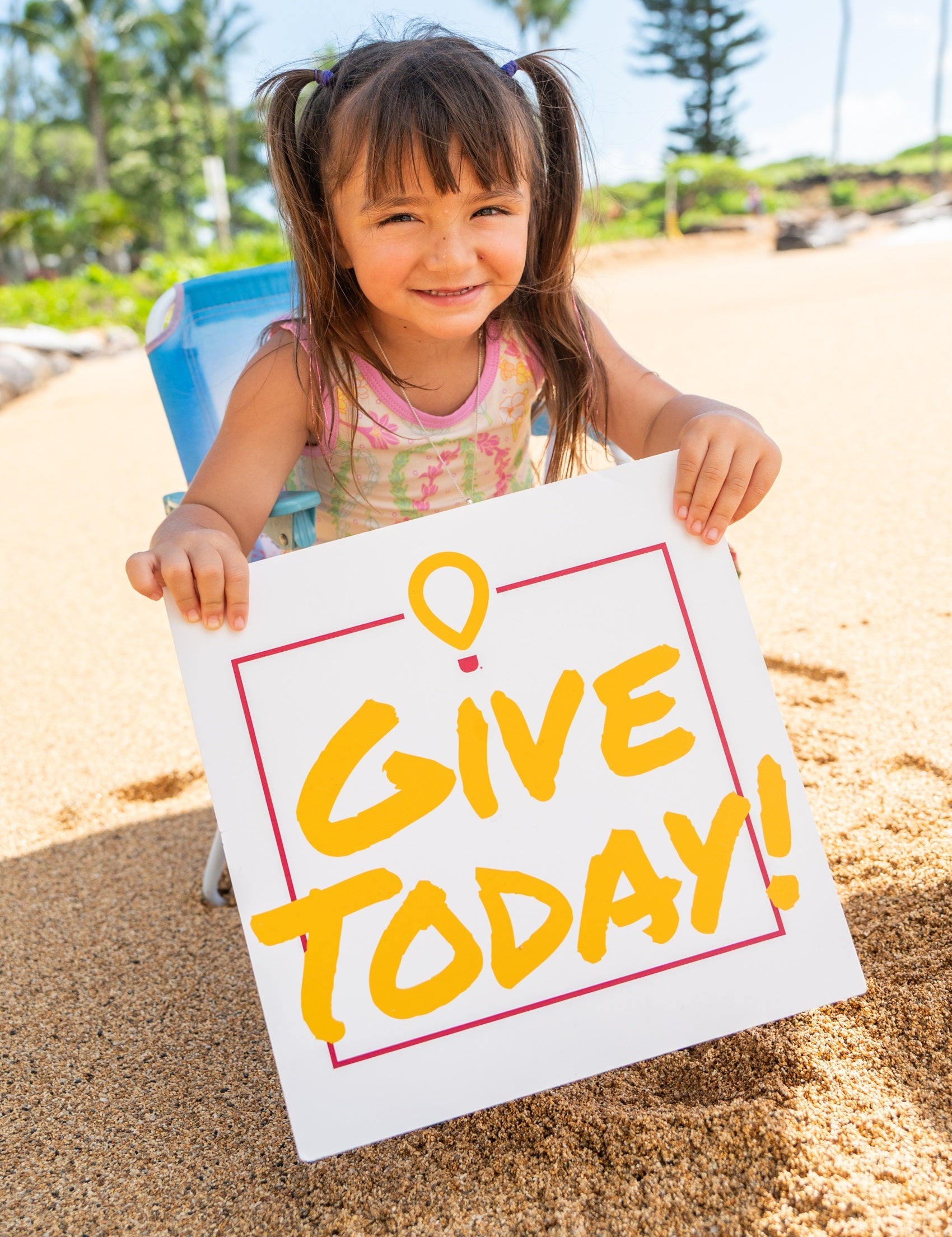 Seeley Borges with Give Today Sign